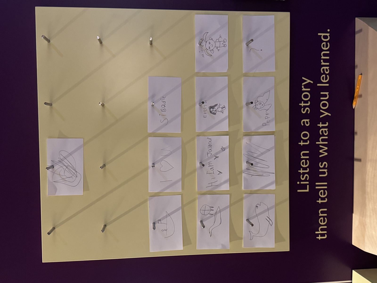 Board showing children's drawings pinned up after listening to Mi'kmaw stories