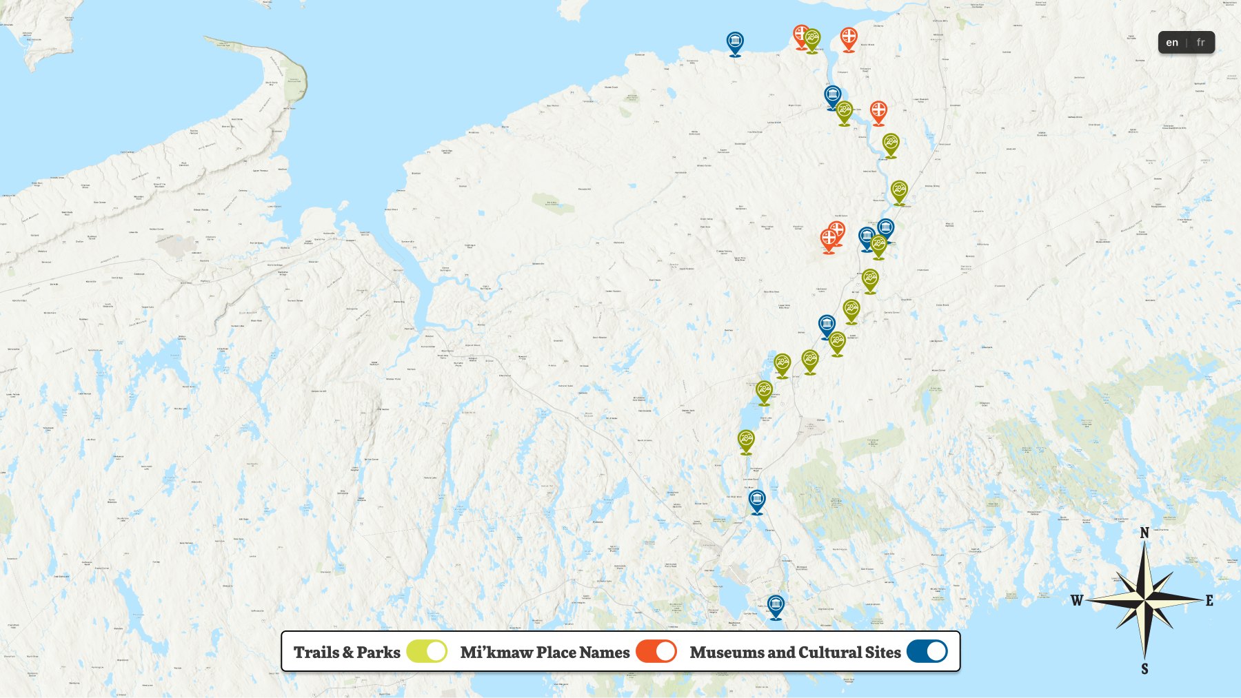 The interactive map screen — the waterway with colour-coded markers, a compass rose, a language toggle, and three filter switches along the bottom