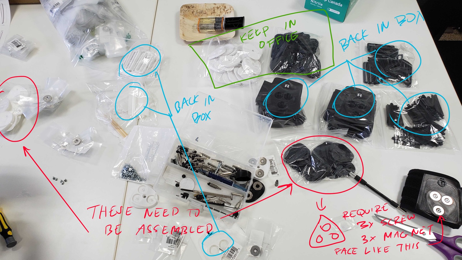 Photograph of disassembled strap components annotated by hand with assembly instructions