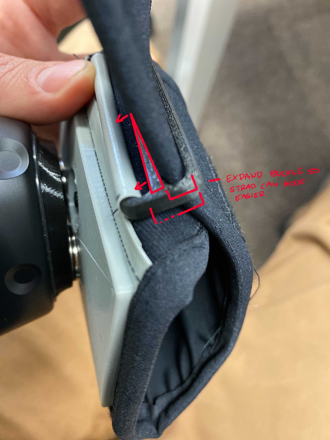 Annotated photo of a prototype buckle requesting more clearance