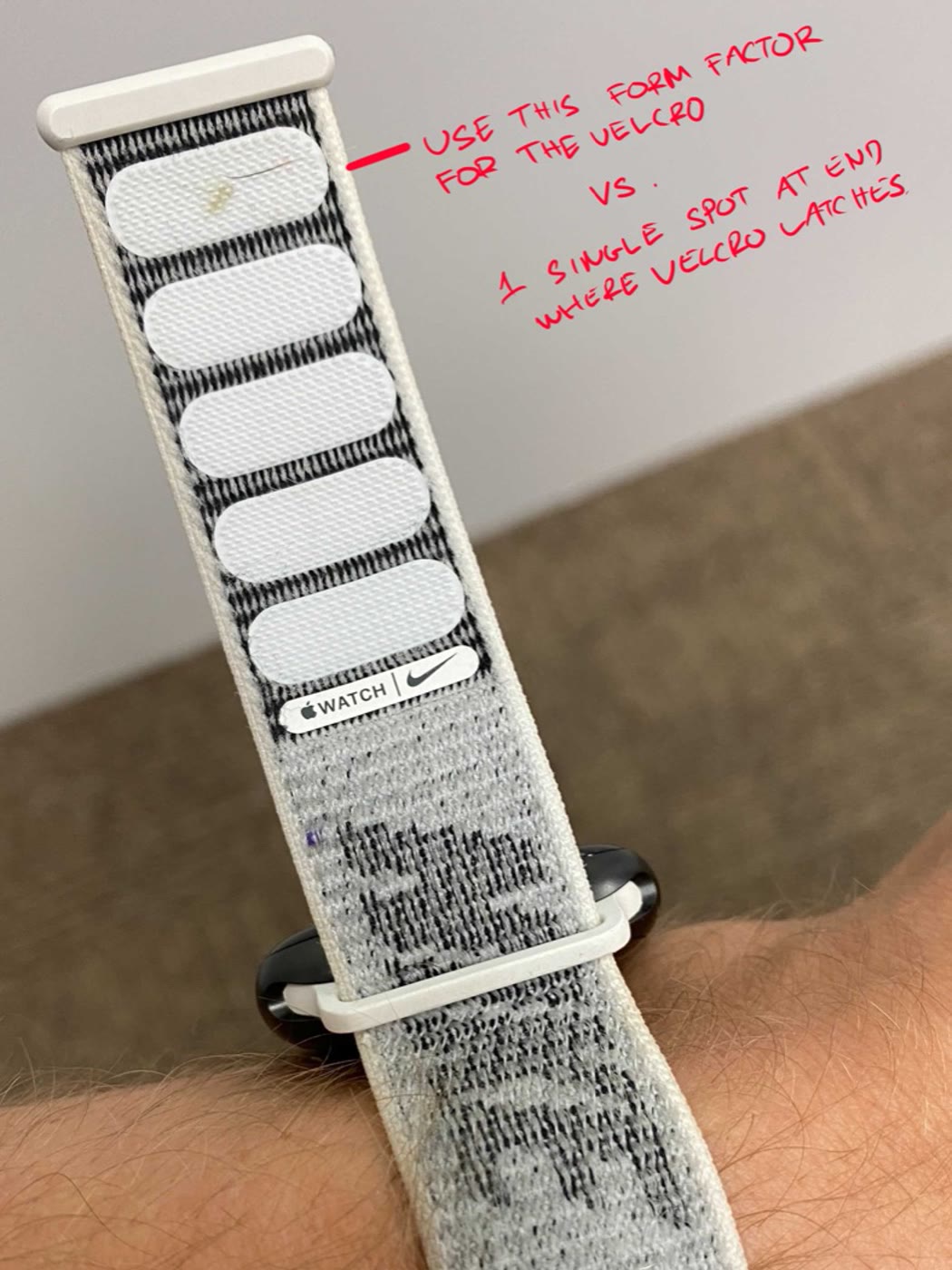 Annotated photo of an Apple Watch Nike sport loop worn on a wrist, proposing its Velcro pattern