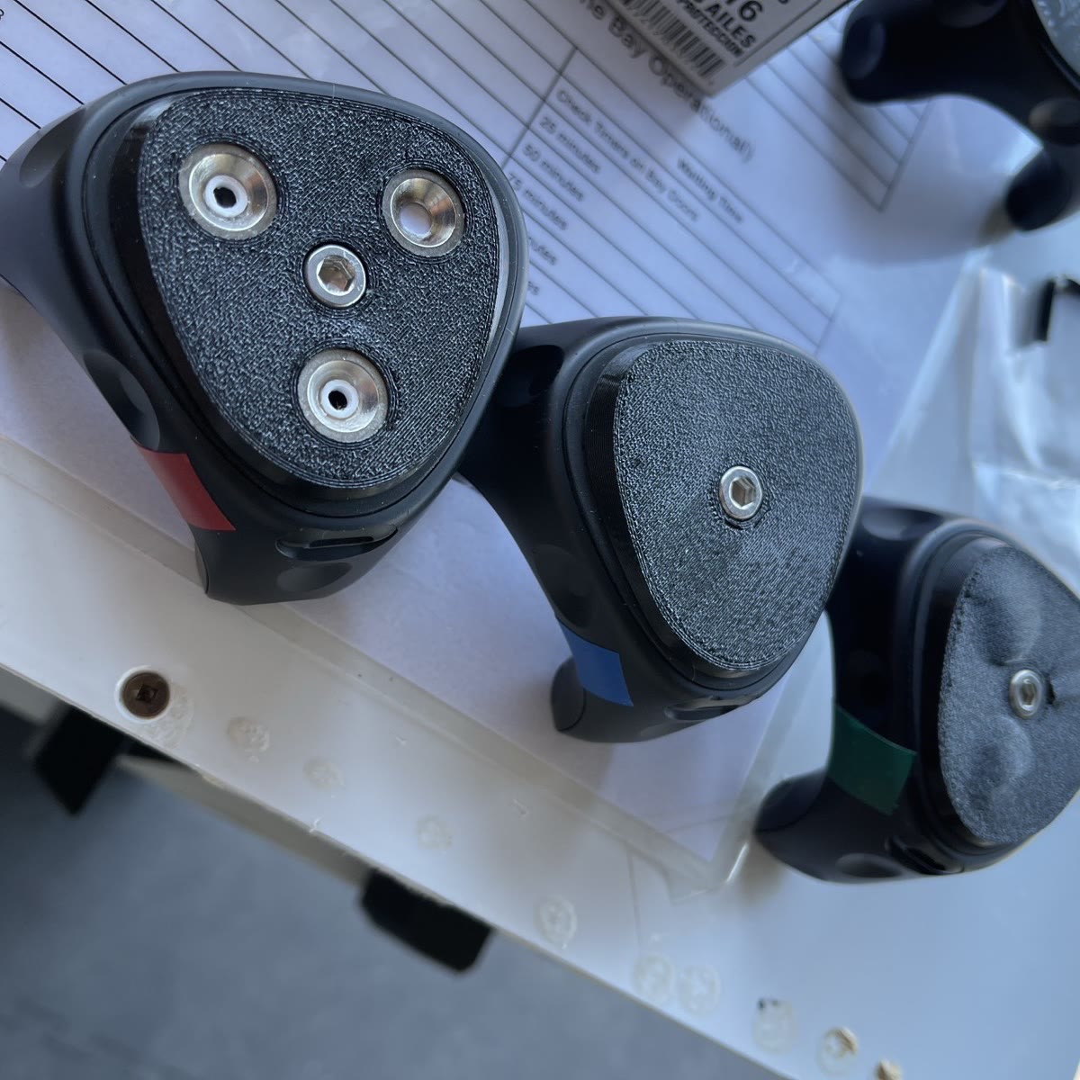 Three tracker mounts with different underside treatments, built to test which held best